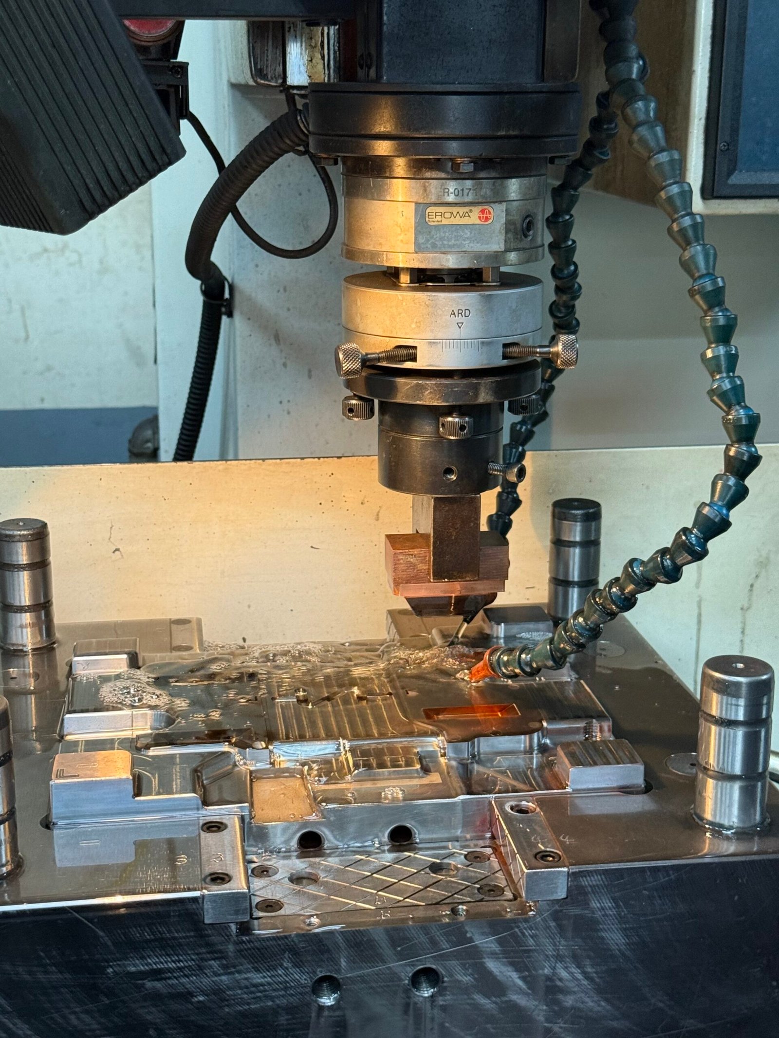 EDM spark erosion machining of injection mold tooling for plastic parts - Emberon